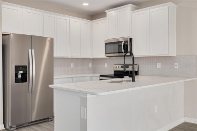 This tastefully done resort style townhome in a gated community on Gulf Harbors Golf Course in Florida - for sale on GolfHomes.com, golf home, golf lot