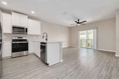 This tastefully done resort style townhome in a gated community on Gulf Harbors Golf Course in Florida - for sale on GolfHomes.com, golf home, golf lot