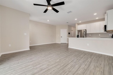 This tastefully done resort style townhome in a gated community on Gulf Harbors Golf Course in Florida - for sale on GolfHomes.com, golf home, golf lot