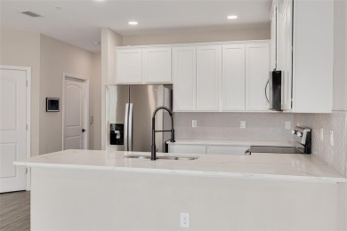 This tastefully done resort style townhome in a gated community on Gulf Harbors Golf Course in Florida - for sale on GolfHomes.com, golf home, golf lot