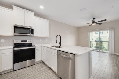 This tastefully done resort style townhome in a gated community on Gulf Harbors Golf Course in Florida - for sale on GolfHomes.com, golf home, golf lot