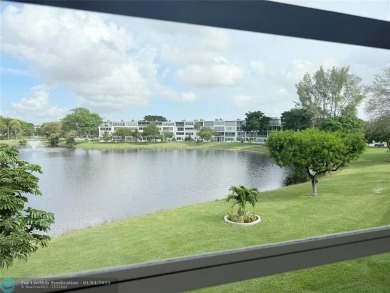 This elegant 2-bedroom 2-bathroom condo features a SPACIOUS on Hillsboro Pines Golf in Florida - for sale on GolfHomes.com, golf home, golf lot