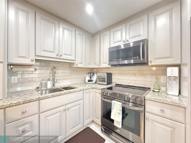 This elegant 2-bedroom 2-bathroom condo features a SPACIOUS on Hillsboro Pines Golf in Florida - for sale on GolfHomes.com, golf home, golf lot