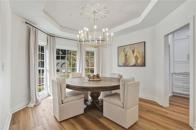 Experience the ultimate in refined living with this stunning 4 on Towne Lake Hills Golf Club in Georgia - for sale on GolfHomes.com, golf home, golf lot