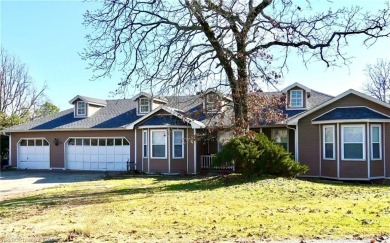 Welcome to this spacious two-level home offering 5 bedrooms, 2.5 on Vache-Grasse Country Club in Arkansas - for sale on GolfHomes.com, golf home, golf lot