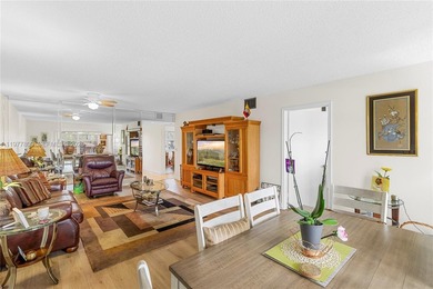 Enjoy spectacular lake and golf course views from this spacious on Flamingo Lakes Country Club in Florida - for sale on GolfHomes.com, golf home, golf lot