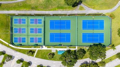 Enjoy spectacular lake and golf course views from this spacious on Flamingo Lakes Country Club in Florida - for sale on GolfHomes.com, golf home, golf lot