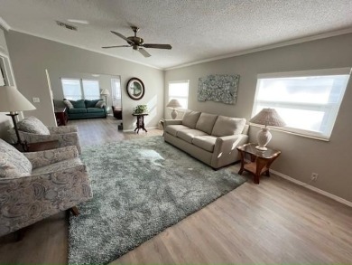 Welcome your guests to a private and serene space, situated on on Del Tura Golf and Country Club in Florida - for sale on GolfHomes.com, golf home, golf lot