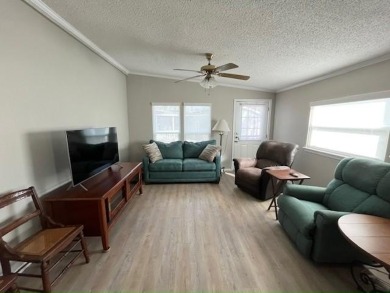 Welcome your guests to a private and serene space, situated on on Del Tura Golf and Country Club in Florida - for sale on GolfHomes.com, golf home, golf lot