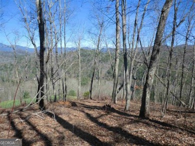 There are amazing views of layered mountains to the east and on Waterfall Country Club in Georgia - for sale on GolfHomes.com, golf home, golf lot