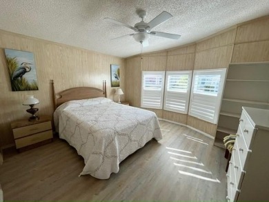 Welcome your guests to a private and serene space, situated on on Del Tura Golf and Country Club in Florida - for sale on GolfHomes.com, golf home, golf lot