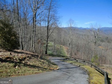 There are amazing views of layered mountains to the east and on Waterfall Country Club in Georgia - for sale on GolfHomes.com, golf home, golf lot