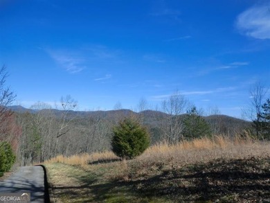 There are amazing views of layered mountains to the east and on Waterfall Country Club in Georgia - for sale on GolfHomes.com, golf home, golf lot