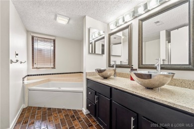 Welcome to this spacious yet cozy, 3 Bedroom, 2 Bath, end unit on Seasons Ridge At Four Seasons in Missouri - for sale on GolfHomes.com, golf home, golf lot