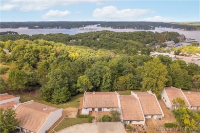 Welcome to this spacious yet cozy, 3 Bedroom, 2 Bath, end unit on Seasons Ridge At Four Seasons in Missouri - for sale on GolfHomes.com, golf home, golf lot