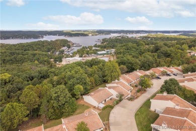 Welcome to this spacious yet cozy, 3 Bedroom, 2 Bath, end unit on Seasons Ridge At Four Seasons in Missouri - for sale on GolfHomes.com, golf home, golf lot