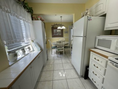 BIG PRICE ADJUSTMENT!  Well-maintained 2 bed/2 bath condo in on Kings Point Golf -Flanders Way in Florida - for sale on GolfHomes.com, golf home, golf lot