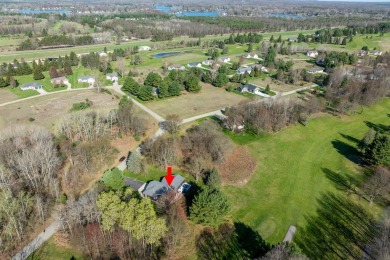Welcome to your new home on the green! Nestled on nearly on Canadian Lakes Country Club-The Royal Course in Michigan - for sale on GolfHomes.com, golf home, golf lot