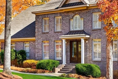 Tucked beneath a canopy of mature hardwoods and overlooking the on Moores Mill Golf Club in Alabama - for sale on GolfHomes.com, golf home, golf lot