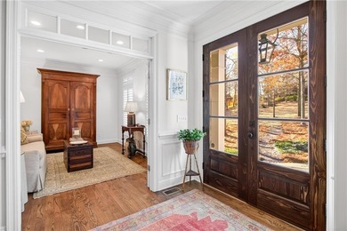 Tucked beneath a canopy of mature hardwoods and overlooking the on Moores Mill Golf Club in Alabama - for sale on GolfHomes.com, golf home, golf lot