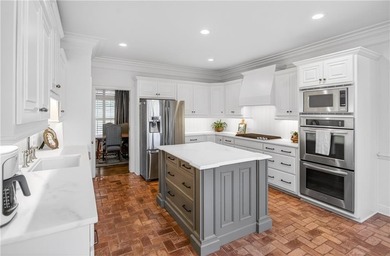 Tucked beneath a canopy of mature hardwoods and overlooking the on Moores Mill Golf Club in Alabama - for sale on GolfHomes.com, golf home, golf lot