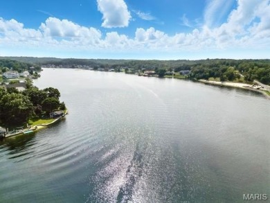 Lake Front Lot on Almost 1/2 Acre Lot on Small Private Lake on Raintree Country Club in Missouri - for sale on GolfHomes.com, golf home, golf lot