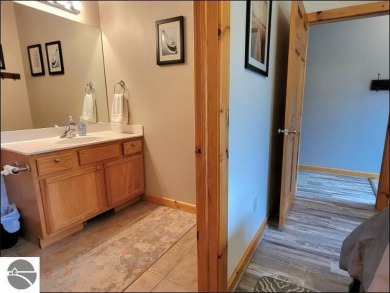 Enjoy resort-style living in this beautifully furnished condo on Schuss Mountain Golf Club in Michigan - for sale on GolfHomes.com, golf home, golf lot
