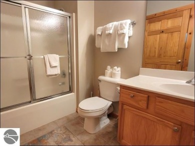 Enjoy resort-style living in this beautifully furnished condo on Schuss Mountain Golf Club in Michigan - for sale on GolfHomes.com, golf home, golf lot