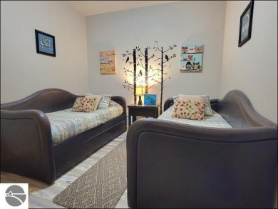 Enjoy resort-style living in this beautifully furnished condo on Schuss Mountain Golf Club in Michigan - for sale on GolfHomes.com, golf home, golf lot