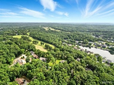 Lake Front Lot on Almost 1/2 Acre Lot on Small Private Lake on Raintree Country Club in Missouri - for sale on GolfHomes.com, golf home, golf lot