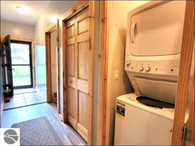 Enjoy resort-style living in this beautifully furnished condo on Schuss Mountain Golf Club in Michigan - for sale on GolfHomes.com, golf home, golf lot