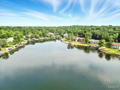 Lake Front Lot on Almost 1/2 Acre Lot on Small Private Lake on Raintree Country Club in Missouri - for sale on GolfHomes.com, golf home, golf lot