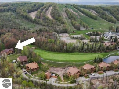 Enjoy resort-style living in this beautifully furnished condo on Schuss Mountain Golf Club in Michigan - for sale on GolfHomes.com, golf home, golf lot