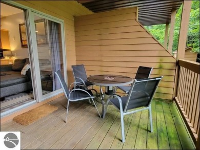 Enjoy resort-style living in this beautifully furnished condo on Schuss Mountain Golf Club in Michigan - for sale on GolfHomes.com, golf home, golf lot