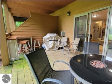 Enjoy resort-style living in this beautifully furnished condo on Schuss Mountain Golf Club in Michigan - for sale on GolfHomes.com, golf home, golf lot