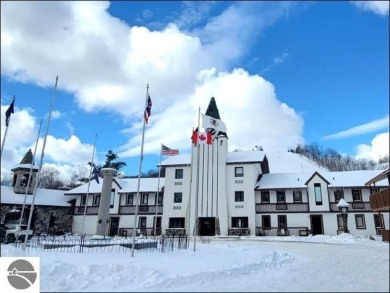 Enjoy resort-style living in this beautifully furnished condo on Schuss Mountain Golf Club in Michigan - for sale on GolfHomes.com, golf home, golf lot