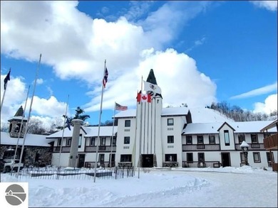 Enjoy resort-style living in this beautifully furnished condo on Schuss Mountain Golf Club in Michigan - for sale on GolfHomes.com, golf home, golf lot