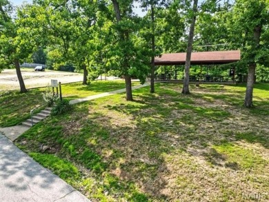 Lake Front Lot on Almost 1/2 Acre Lot on Small Private Lake on Raintree Country Club in Missouri - for sale on GolfHomes.com, golf home, golf lot