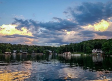 Lake Front Lot on Almost 1/2 Acre Lot on Small Private Lake on Raintree Country Club in Missouri - for sale on GolfHomes.com, golf home, golf lot