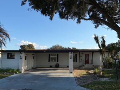 Very spacious canal front two bedroom, two bath home with a on Golden Lakes Golf Course in Florida - for sale on GolfHomes.com, golf home, golf lot