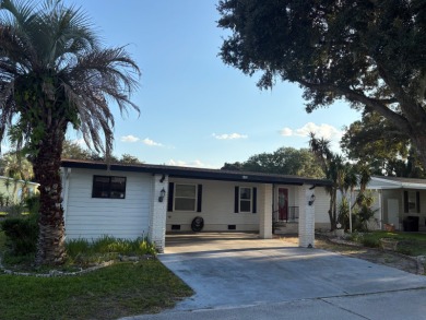 Very spacious canal front two bedroom, two bath home with a on Golden Lakes Golf Course in Florida - for sale on GolfHomes.com, golf home, golf lot