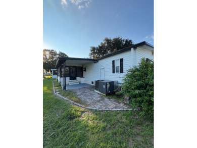 Very spacious canal front two bedroom, two bath home with a on Golden Lakes Golf Course in Florida - for sale on GolfHomes.com, golf home, golf lot