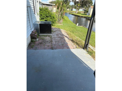 Very spacious canal front two bedroom, two bath home with a on Golden Lakes Golf Course in Florida - for sale on GolfHomes.com, golf home, golf lot