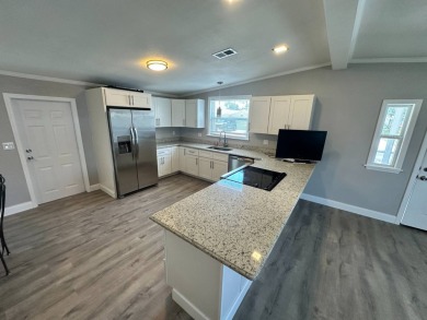 Lot rent is $1037.00    This beautiful 2 bedroom, 2 bathroom on Del Tura Golf and Country Club in Florida - for sale on GolfHomes.com, golf home, golf lot