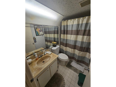 This inviting 2-bedroom, 1.5-bathroom condo on the 2nd floor on Flamingo Lakes Country Club in Florida - for sale on GolfHomes.com, golf home, golf lot