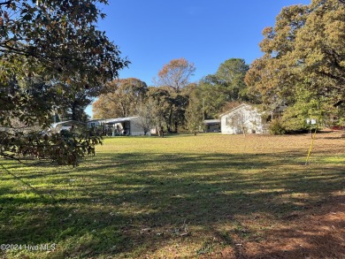 The perfect place to put a tiny house, single wide or camper on Bayview Golf Course in North Carolina - for sale on GolfHomes.com, golf home, golf lot