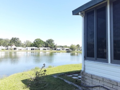 This waterfront 1792 sq ft 3 bedroom manufactured home is in 55+ on Schalamar Creek Golf and Country Club in Florida - for sale on GolfHomes.com, golf home, golf lot
