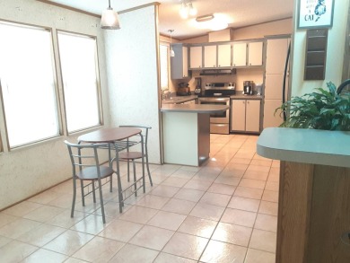 This waterfront 1792 sq ft 3 bedroom manufactured home is in 55+ on Schalamar Creek Golf and Country Club in Florida - for sale on GolfHomes.com, golf home, golf lot