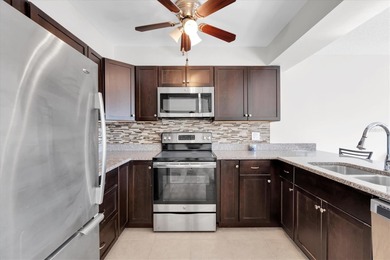 This charming, 2-bedroom, 2-bath condo is located in the very on East Bay Golf Club in Florida - for sale on GolfHomes.com, golf home, golf lot