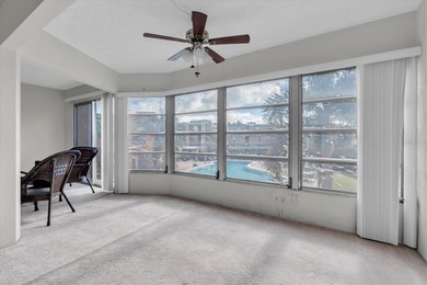 This charming, 2-bedroom, 2-bath condo is located in the very on East Bay Golf Club in Florida - for sale on GolfHomes.com, golf home, golf lot